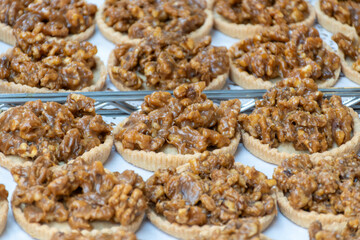 Walnuts tart cake form Perigord, Dordogne, fresh baked nuts cake on local farmers market in Saplat-du-Caneda, Perigord, France