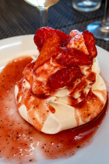 Sweet french dessert, Red strawberry fruit pavlova served in restaurant in Saint-Tropez, France