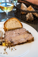 Terrine foie gras fat liver specialty food product made of liver of a duck or goose fattened by force feeding, served in French restaurant in Perigoed, Dordogne, close up