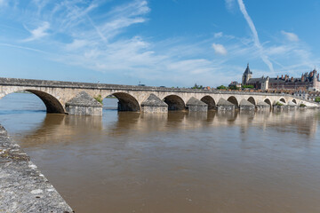 Fototapeta premium Views of old part of town of Gien is on the Loire river, in Loiret department, France, bridge and castle