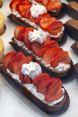 French cuisine, fresh baked iced strawberry cake with chantilly cream, sweet dessert