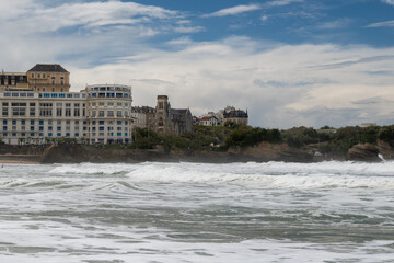 Fototapeta premium Panoramic view from Grand Plage on cliffs, lhouses, sandy beaches of touristic Biarritz city, Basque Country, Bay of Biscay of Atlantic ocean, France