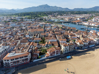Obraz premium Aerial view on Ciboure and Saint Jean de Luz bay, port, sandy beach on Basque coast, beautiful architecture, nature and cuisine, South of France, Basque Country