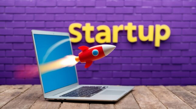 Toy rocket taking off from laptop screen, purple brick wall in background with word startup, business and technology concept.
