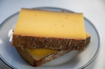 French cheese Comte, varieties unpasteurised ed milk Prestige, fruity flavoured Fruite and Vieille Reserve close up