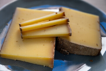 French cheese Comte, varieties unpasteurised ed milk Prestige, fruity flavoured Fruite and Vieille Reserve close up