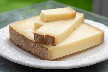 French cheese Comte, varieties unpasteurised ed milk Prestige, fruity flavoured Fruite and Vieille Reserve close up