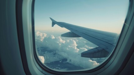 View from an airplane window. The stunning view of the clouds from inside the airplane window during the day creates an unforgettable magical moment.