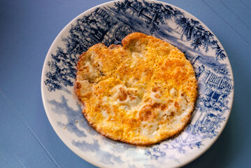A fried egg on a plate. Breakfast. healthy eating.