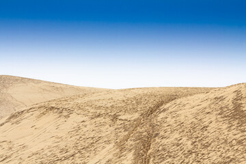 Scenic View of Dune du Pyla Under a Clear Blue Sky in France. Pilat, or Pyla Dune is the biggest sand dune in Europe, in Arcachon Bay, in Aquitaine.