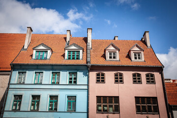 Vintage stone buildings, residential facades, in a typical street in Riga, in Vecriga Vecpilseta, the historical center old town of Latvian capital city.