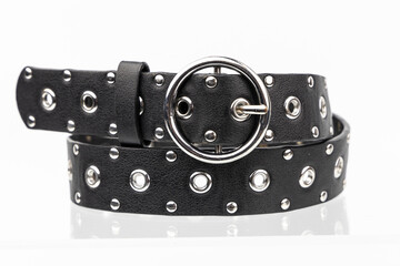 Black Emo Punk Metal leather belt on a white background. Retro Vintage cow hide belt.