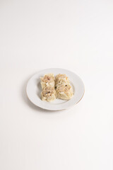 chicken and beef dimsum served on white plate and white background, unique food from china