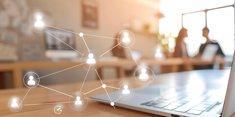 A laptop with a network of people on the screen. The people are connected to each other in a web-like pattern. Concept of interconnectedness and collaboration