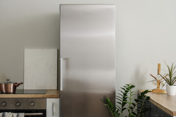 Modern fridge in interior of kitchen