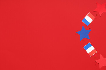 French flags and stars on red background. Bastille Day celebration
