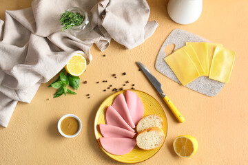 Plate with slices of tasty boiled sausage, bread, cheese and mustard sauce on beige background