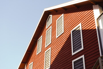 Low angle view of a old red wooden building