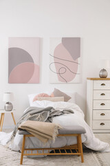 Teen's room interior with modern furniture and beautiful pictures on wall