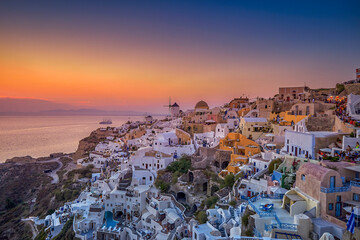 Beautiful summer view from Oia village in Santorini island at sunset