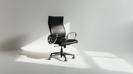 Empty white room with a sleek black office chair featuring chrome accents