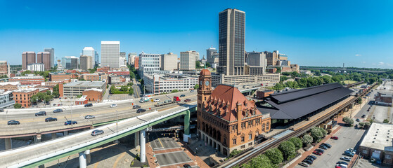Aerial view of downtown Richmond with skyscrapers, historic Main Street train station