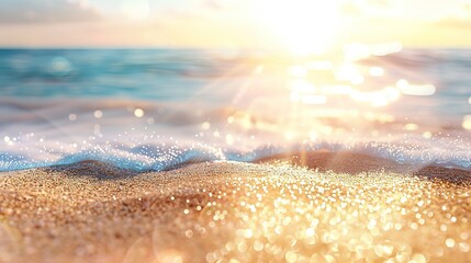 Close-up view of a sandy beach with the ocean in the background. The focus is on the sparkling sand with sunlight reflecting off it, creating a bokeh effect