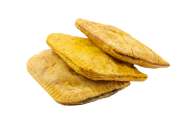 Three flaky Jamaican spicy beef, chicken or veggie patties isolated on white