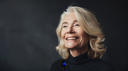 Attractive blonde senior woman posing for photograph with perfect smile, in front of camera