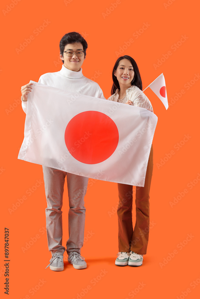 Sticker young asian couple with flags of japan on orange background