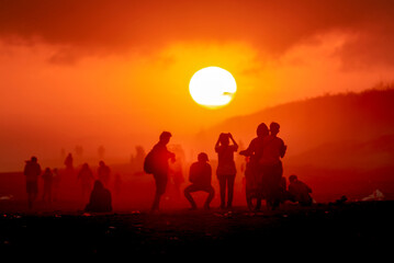 silhouette of people enjoying the beautiful sunset