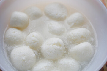 close up of indian sweet in a bowl on table.