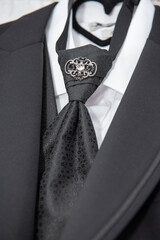 groom suit decorated with accessories,