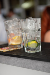 preparing a cocktail with ice and fruit  at the wedding