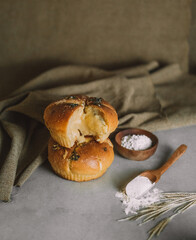 a single slice of garlic bread on a wooden cutting board