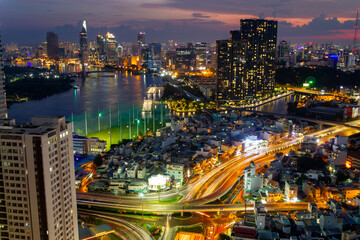 Fototapeta premium Aerial View Of Ho Chi Minh City With Skyscrapers In Downtown At Sunset, Vietnam.