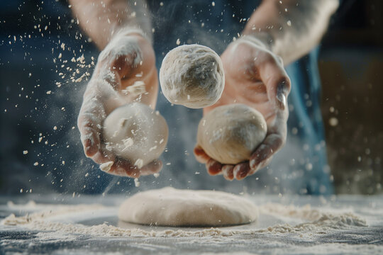 person is making dough and throwing it in the air. The dough is in the shape of a ball
