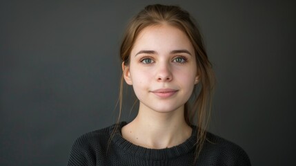 An engaging portrait of a young female presenter with a solid background, emphasizing her articulate expression and captivating presence