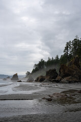Pacific Ocean coast on a cold summer day, cloudy day on a rocky beach, Pacific Ocean coast in Washington state, near Seattle