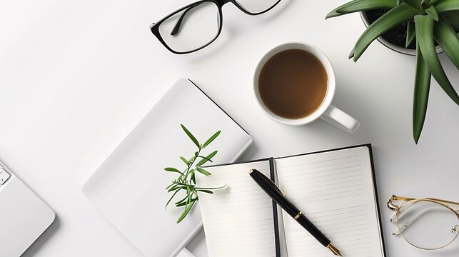 Ultra-clear flat lay of work essentials including a diary, pen, and eyeglasses