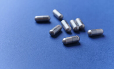 BCAA amino acids. Nutrition for bodybuilding. Fitness supplements on dark background. Soft focus. Copy space.	