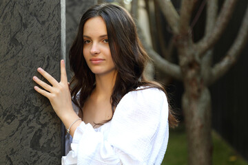 Fototapeta premium KYITeenage girl posing for a photographer. Young and beautiful teenage girl.
