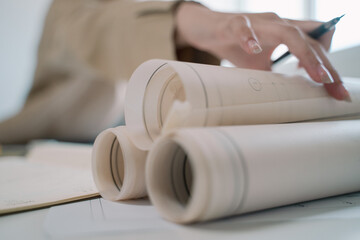 The architect carefully crafted the blueprint, transforming the detailed plan into a precise drawing for the ambitious project ahead.