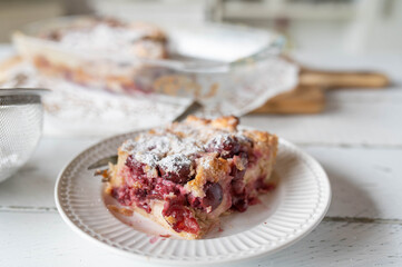 Piece of delicious sweet casserole with cherries. Delicious german summer dessert called Kirschen Michel