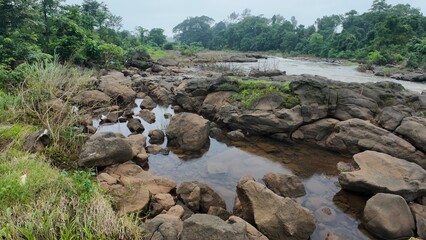 Scenic rocky landscape with water potholes by a stream