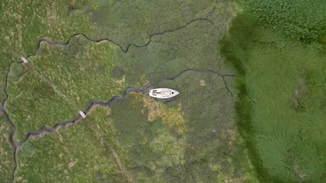 More lonely boats stranded without water