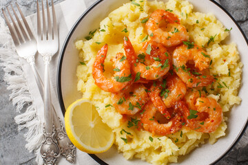 Garlicky Lemon Shrimp with Mashed Potatoes closeup on the plate on the table. Horizontal top view from above