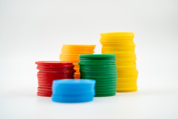 Colourful poker chips isolated over white background.