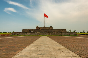 Fototapeta premium Ngo Mon square with the flag tower Ky Dai in the Citadel - the Imperial Place in Hue city, Vietnam