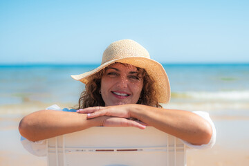 Tourist On The Beach Looking At Camera.